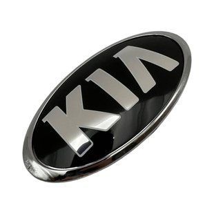 Купити Емблема Kia СТАРОГО ТИПУ Чорна (старий шрифт) 170x84 мм (хромований обідок) Пластикова (на скотчі + 3 ніжки) (Заводська) 88611 Емблеми на іномарки