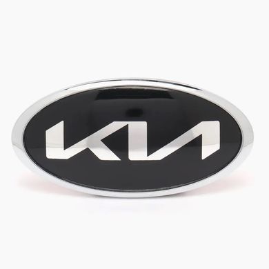 Купити Емблема Kia NEW TYPE, чорна (новий шрифт), 183x92 мм (хромований обідок), алюміній + ABS (на скотчі + 2 ніжки) (заводська) 88594 Емблеми на іномарки